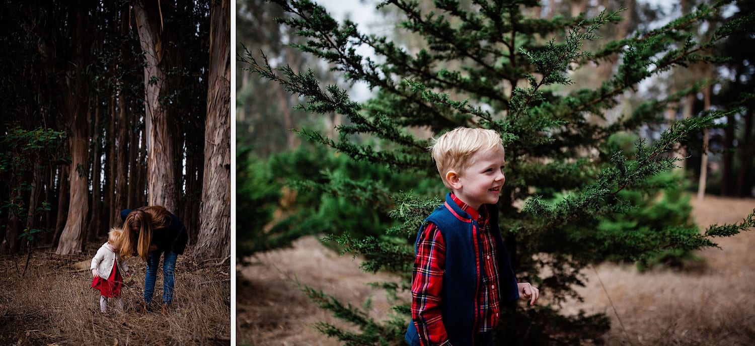 Mom bends to toddler among trees; boy grins by a cypress branch