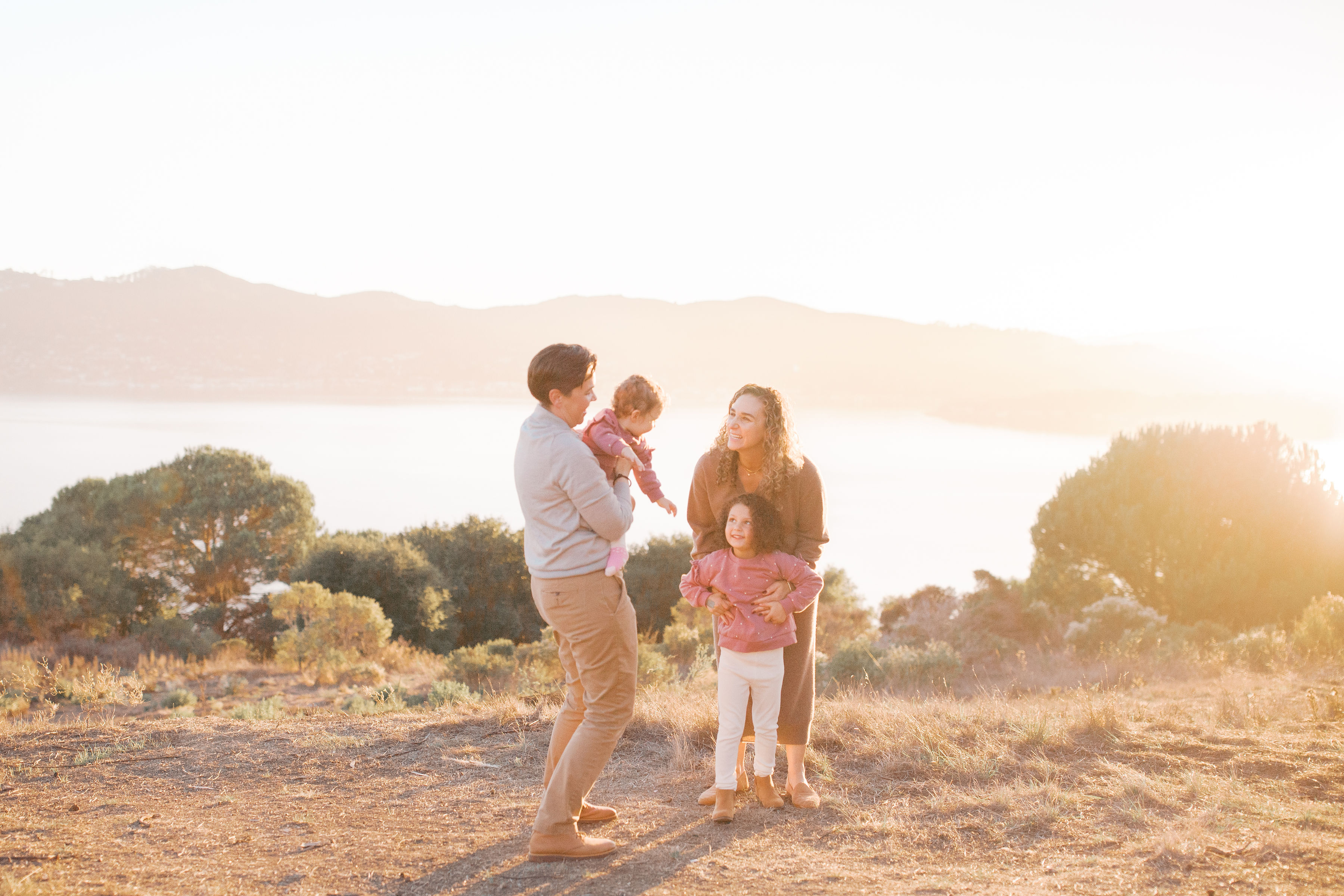 Family of four at golden hour with bay views — family photography in Marin County