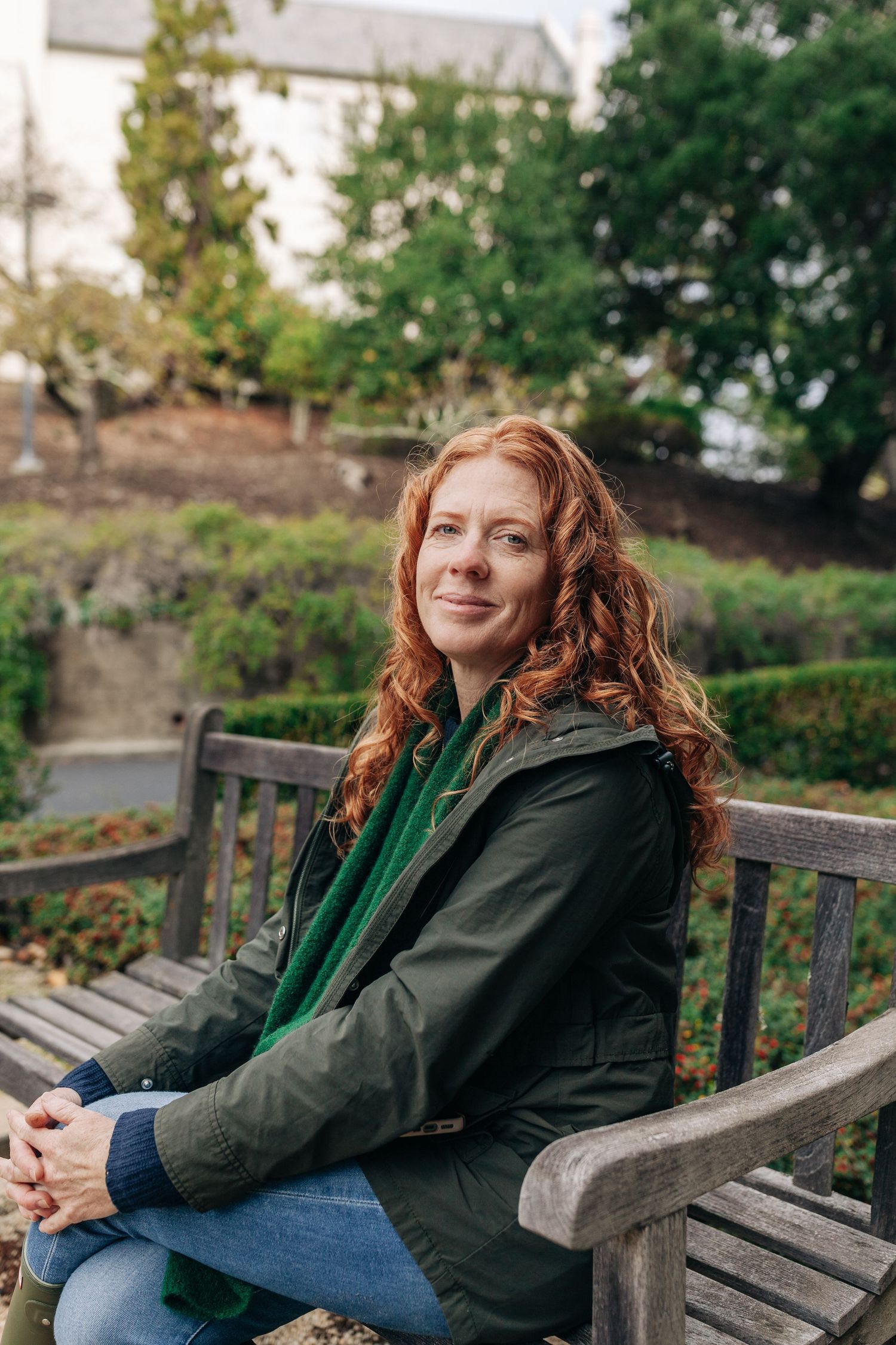 Casual outdoor portrait in a natural green setting — lifestyle headshot