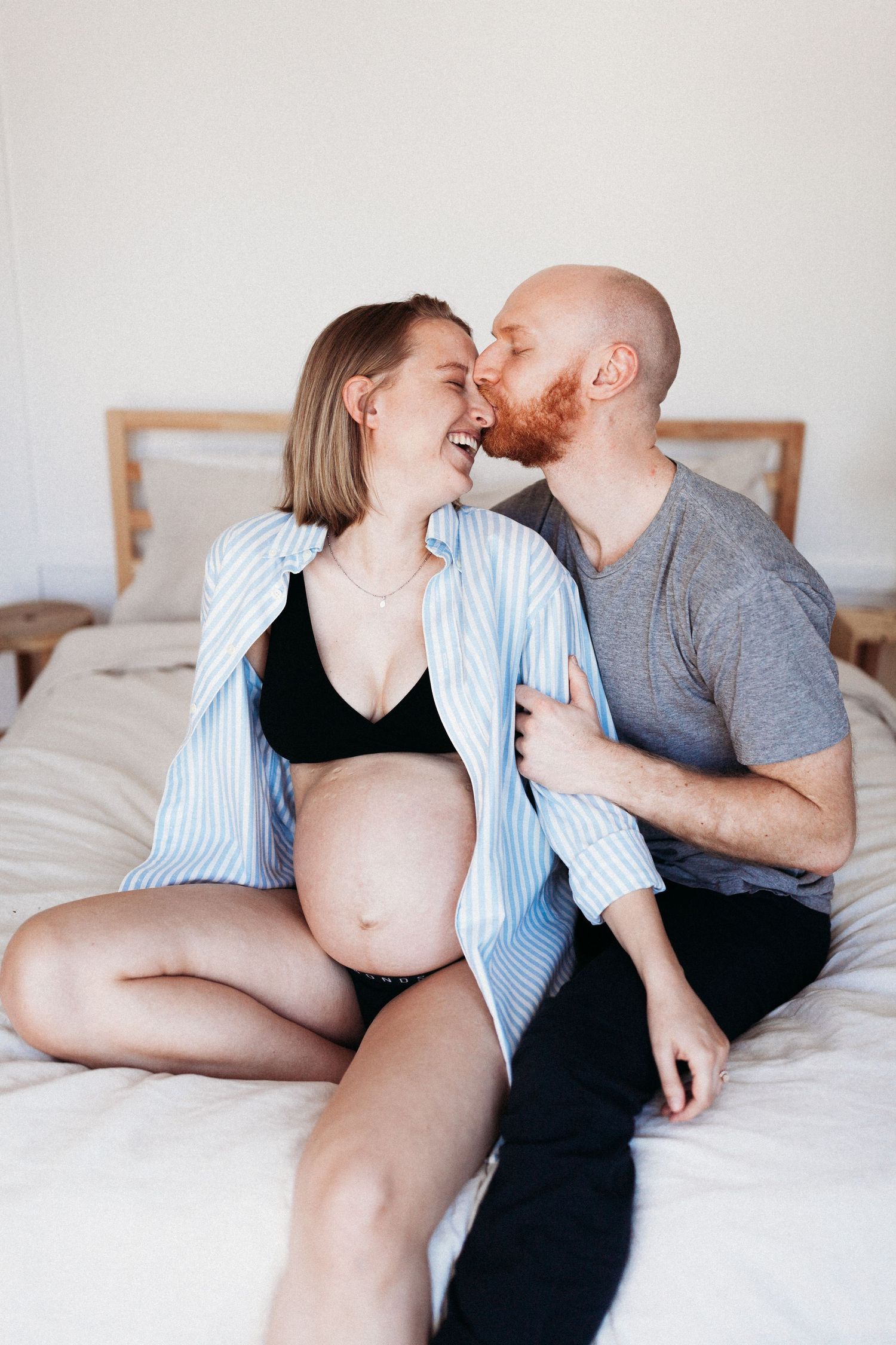 Intimate moment between an expectant couple during a maternity session in Marin County