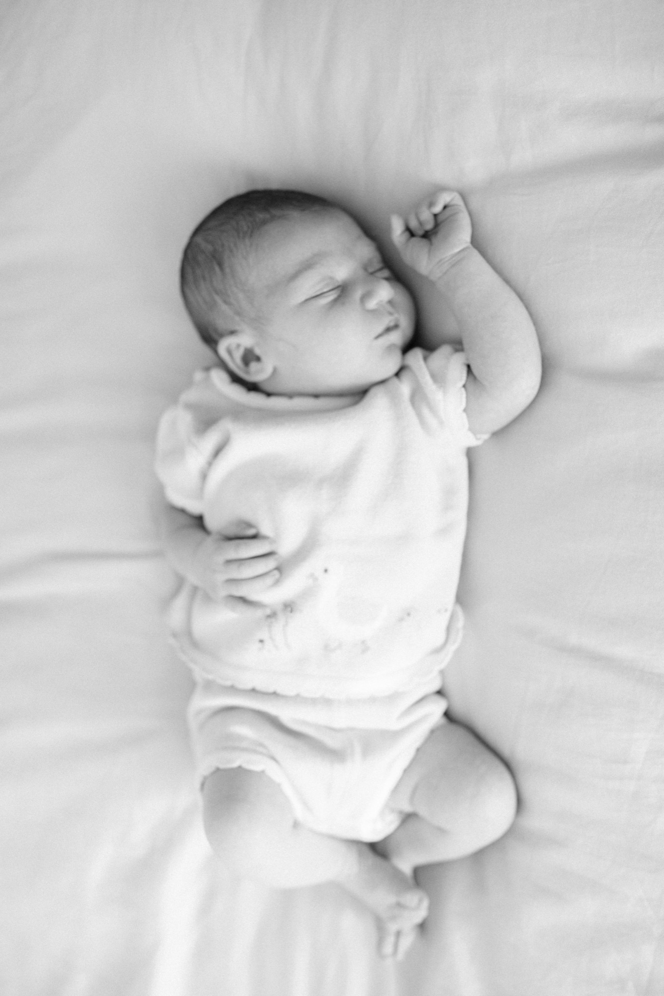 Marin newborn photographer captures two-week-old baby Dalia sleeping peacefully in soft natural light at her Palo Alto home — lifestyle newborn photography in the San Francisco Bay Area.